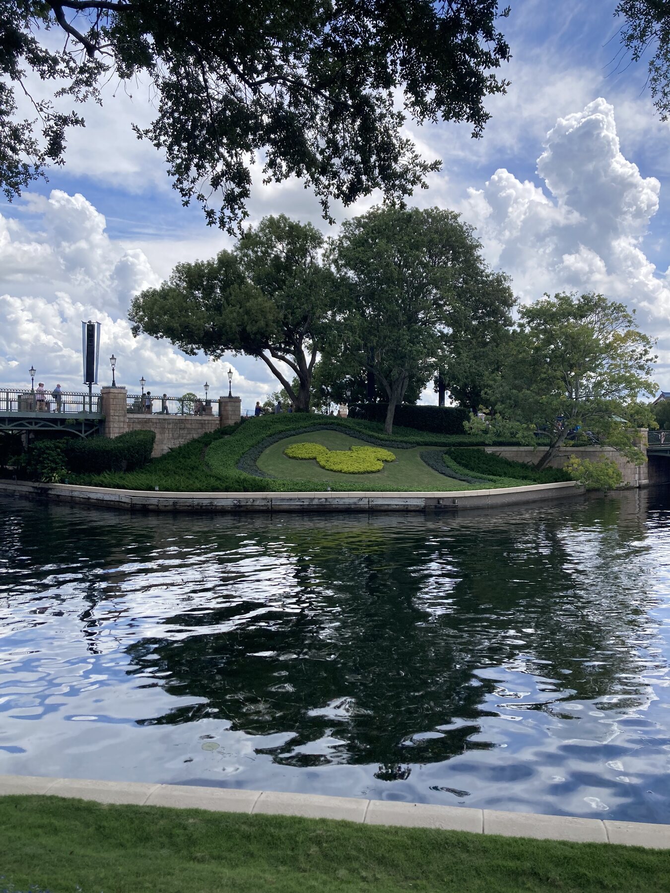 Mickey-shaped garden beside a lagoon at Walt Disney World
